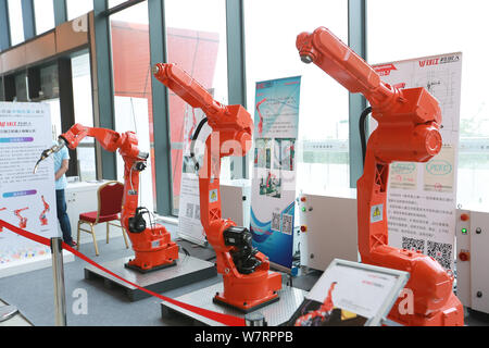 Robot arms are on display during the 4th China Robotop and Intelligent Economic Talents Summit in Yuyao city under Ningbo city, east China's Zhejiang Stock Photo