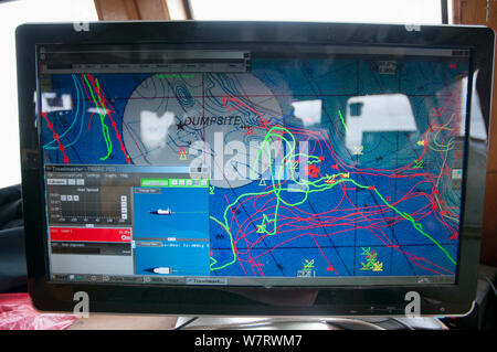 Computer tracking seagoing information aboard commercial fishing trawler. Stellwagen Banks, New England, United States, North Atlantic Ocean Stock Photo