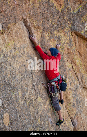 Man climbing the Screaming Yellow Zonkers route in Smith Rocks State Park, Oregon, May 2013. Model released. Stock Photo