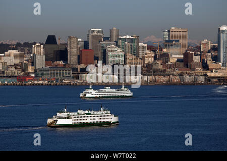 Ferry boat on Elliot Bay and the city of Seattle viewed from Hamilton Viewpoint Park, Washington, USA. January. Stock Photo