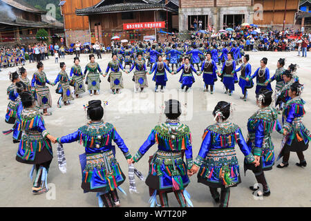 Chinese participants from the Dong ethnic minority play Pipa or Chinese lute during a music competition held in Zhuguan village, Liping county, Qiando Stock Photo