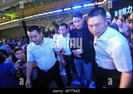 Thai actor Nawat Kulrattanarak, second right, better known by his stage name Pong, attends a launch ceremony for promoting Thai TV soap operas in Nann Stock Photo