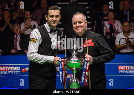 Mark Selby of England left shakes hands with John Higgins of Scotland before their final match during the 2017 Betfred World Snooker Championship at Stock Photo Alamy