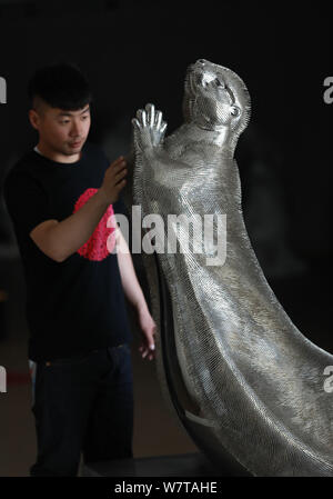 The otter sculpture made by Professor Xie Yong of Shenyang University out of 300,000 sewing needles is on display at his studio in Shenyang city, nort Stock Photo