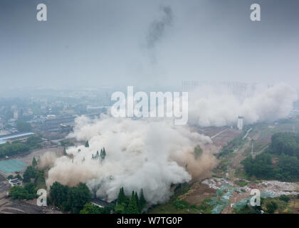 Dense smoke spreads after two 180-meter-tall chimneys and a cooling tower were demolished by explosion at Nanjing No.2 Thermal Power Plant in Nanjing Stock Photo