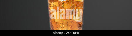 Whisky background - malt whisky on rocks isolated on dark backdrop Stock Photo