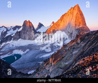 Granite spires (Snowpatch, Pigeon, Bugaboo, from left to right) above the Crescent Glacier, Bugaboo Provincial Park, British Columbia, Canada, August 2013. Stock Photo