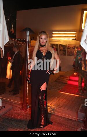 American socialite Paris Hilton poses as she arrives at the Persol Party during the 70th Cannes Film Festival in Cannes, France, 24 May 2017. Stock Photo