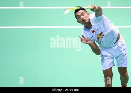 Lin Dan of China returns a shot to Lee Dong-keun of South Korea in their first round match of the men's singles during the 2017 Badminton Asia Champio Stock Photo