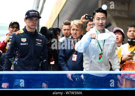 Retired Chinese table tennis player Wang Liqin, right, instructs Dutch F1 driver Max Verstappen of Red Bull Racing ahead of the 2017 Formula One Chine Stock Photo