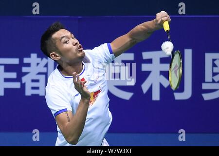 Lin Dan of China returns a shot to Lee Dong-keun of South Korea in their first round match of the men's singles during the 2017 Badminton Asia Champio Stock Photo