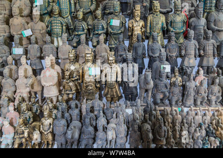 Replicas of terracotta warriors are for sale at a store near the Emperor Qinshihuang's Mausoleum Site Museum in Xi'an city, northwest China's Shaanxi Stock Photo