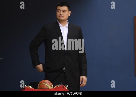 Retired Chinese basketball star Yao Ming, chairman of the Chinese Basketball Association (CBA), watches players of Chinese national women's basketball Stock Photo