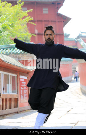 41-year-old Mexican man Mario practises tai chi on the Wudang Mountains in Shiyan city, central China's Hubei province, 27 April 2017.   A Mexican man Stock Photo