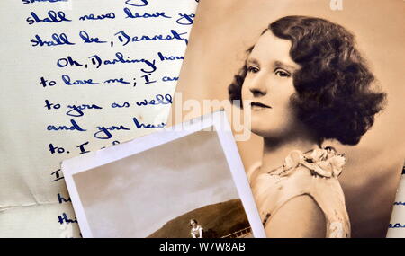 Old black and white photographs on an old 1940's handwritten letter Stock Photo
