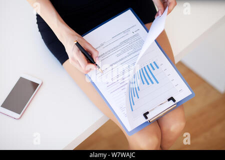Hand of female designer working with her new project at office Stock Photo