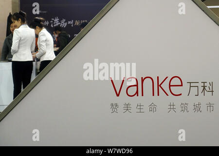 --FILE--A logo of Vanke is pictured at the stand of Vanke during an exhibition in Ji'nan city, east China's Shandong province, 7 April 2016.   China V Stock Photo