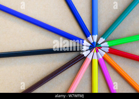 variety different color pencils on blue background Stock Photo