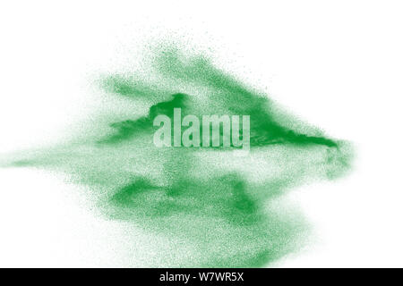 Abstract sand cloud. Green sand splash against  on white background. Sandy fly wave in the air. Stock Photo