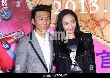 --FILE--Chinese actress Bai Baihe, right, and her singer husband Chen Yufan of Chinese pop duet Yuquan (Yu Quan) arrive on the red carpet for the prem Stock Photo