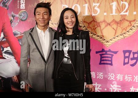 --FILE--Chinese actress Bai Baihe, right, and her singer husband Chen Yufan of Chinese pop duo Yuquan (Yu Quan) arrive on the red carpet for the premi Stock Photo