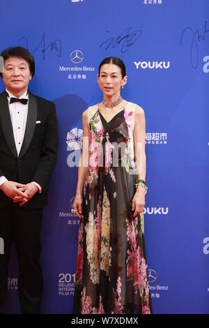 Japanese actress Honami Suzuki, right, attends the awards ceremony of ...