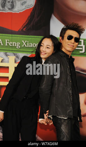 --FILE--Chinese actress Bai Baihe, left, and her singer husband Chen Yufan of Chinese pop duet Yuquan (Yu Quan) attend a press conference for their ne Stock Photo