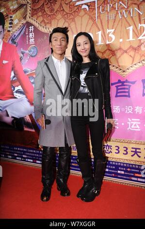 --FILE--Chinese actress Bai Baihe, right, and her singer husband Chen Yufan of Chinese pop duo Yuquan (Yu Quan) arrive on the red carpet for the premi Stock Photo