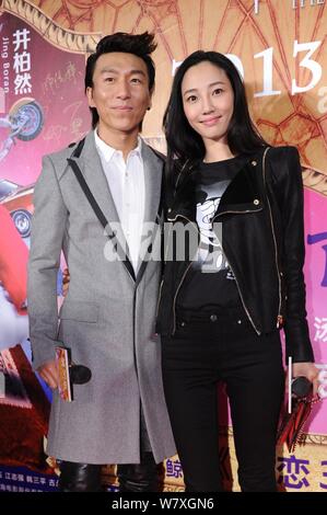 --FILE--Chinese actress Bai Baihe, right, and her singer husband Chen Yufan of Chinese pop duo Yuquan (Yu Quan) arrive on the red carpet for the premi Stock Photo