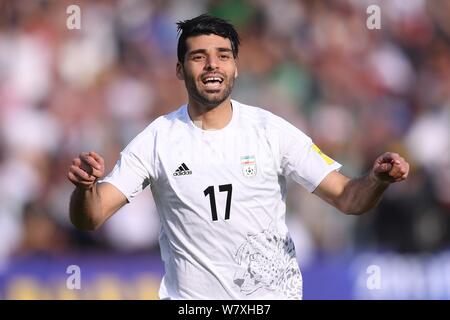 Mehdi Taremi of Iran celebrates after scoring a goal against Chinese national football team in their Group A Round 7 match during the FIFA World Cup 2 Stock Photo