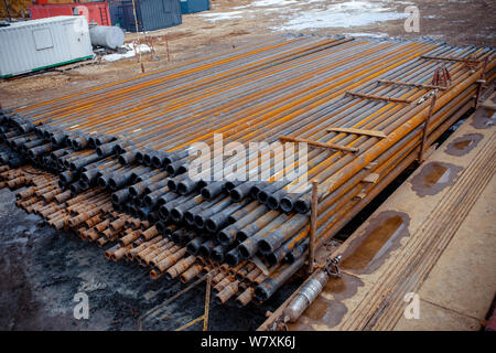 Drilling Module Stack Drill pipe of oil drilling platforms. Stack of oil well casing bundles ...