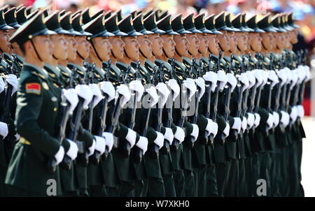 --FILE--Chinese PLA (People's Liberation Army) soldiers march past the Tian'anmen Rostrum during the military parade to commemorate the 70th anniversa Stock Photo