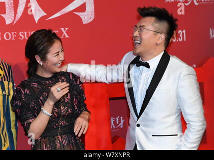 Taiwanese actress Ruby Lin, left, interacts with actor and director Alec Su at the premiere of their new movie ''The Devotion of Suspect X'' in Beijin Stock Photo
