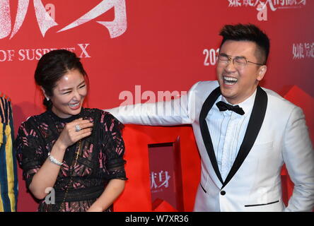 Taiwanese actress Ruby Lin, left, interacts with actor and director Alec Su at the premiere of their new movie ''The Devotion of Suspect X'' in Beijin Stock Photo