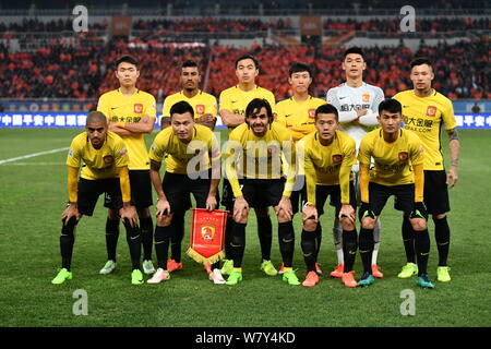 Players of the starting line-up of Guangzhou Evergrande pose before competing against Shandong Luneng during their second round match of the 2017 Chin Stock Photo