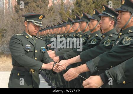 --FILE--Chinese soldiers of the PLA (People's Liberation Army) practise goose steps during a training session for the upcoming military parade to comm Stock Photo