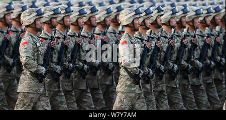 --FILE--Chinese PLA (People's Liberation Army) soldiers march past the Tian'anmen Rostrum during the military parade to commemorate the 70th anniversa Stock Photo