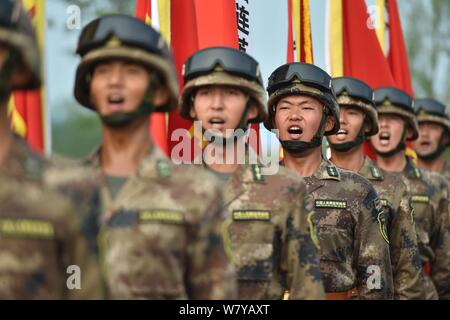 --FILE--Chinese soldiers of the PLA (People's Liberation Army) stand in line during a training session for the upcoming military parade to commemorate Stock Photo