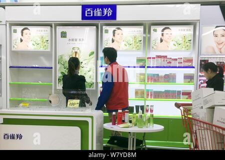 Chinese employees display cosmetics at a Lotte Mart of Lotte Group in Shanghai, China, 4 March 2017.   South Korea's Lotte Group said on Monday (6 Mar Stock Photo