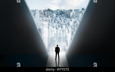 Man standing on break to the modern city between big walls Stock Photo