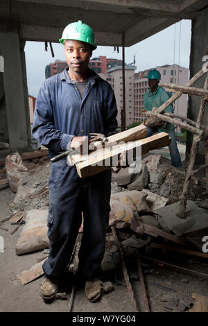 Economic migrants from rural areas working on construction site, Nairobi, Kenya, November 2013. Stock Photo