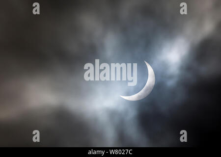 Solar eclipse with partial cloud cover, Peak District, Derbyshire, UK. 20th March 2015. Stock Photo