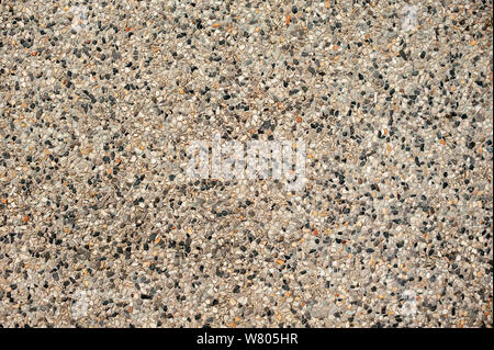 Small stones and sand in concrete. Background for landscape design Stock Photo