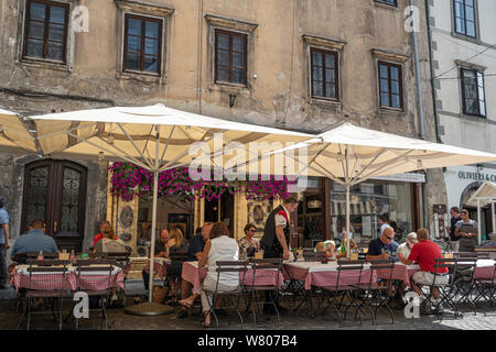 Ljubljana, Slovenia. August 3, 2019.   Outdoor restaurants on a city center street Stock Photo