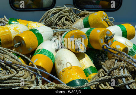 https://l450v.alamy.com/450v/w808jd/crab-trap-floats-and-buoys-pilled-on-a-commercial-fishing-vessel-in-a-marina-in-oregon-usa-w808jd.jpg