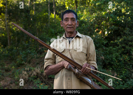Adi Gallong man with bow and arrow. Adi Gallong Tribe. Arunachal Pradesh, North East India, October 2014. Stock Photo