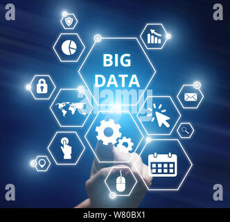 Man hand selecting and pressing settings symbol for big data Stock Photo