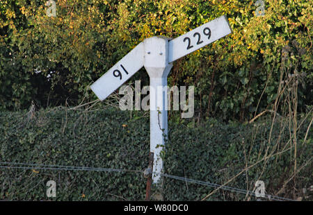 A level or gradient sign by the side of the railway track of the West Somerset heritage railway. Stock Photo