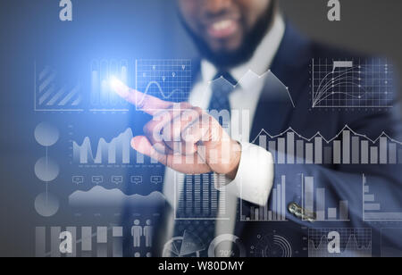 Businessman choosing with finger analytic diagram with data Stock Photo