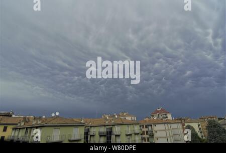 Dark rainy clouds over the Milano city Stock Photo